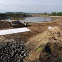 excavator, water basin, sand, front loader